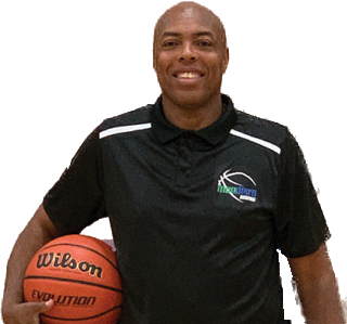 Coach Moe holding a basketball